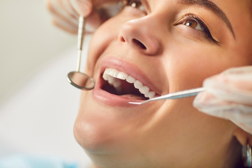 close-up of dentist working on a womans smile makeover