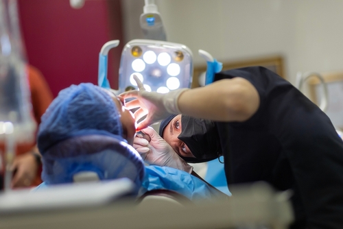 A dentist making a implant operation dental health perfect smile