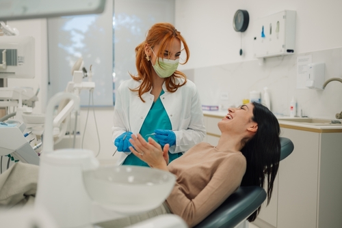dentist talking to patient