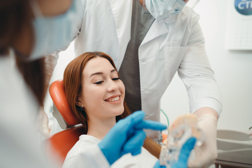 dentist showing dental bridge procedure