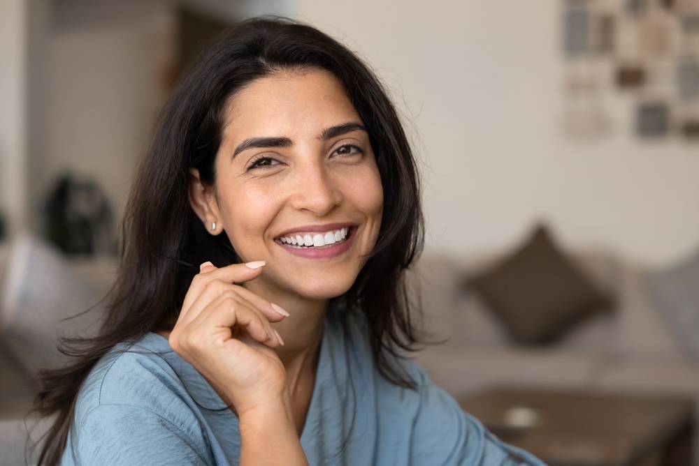closeup of a female smiling with beautiful white teeth